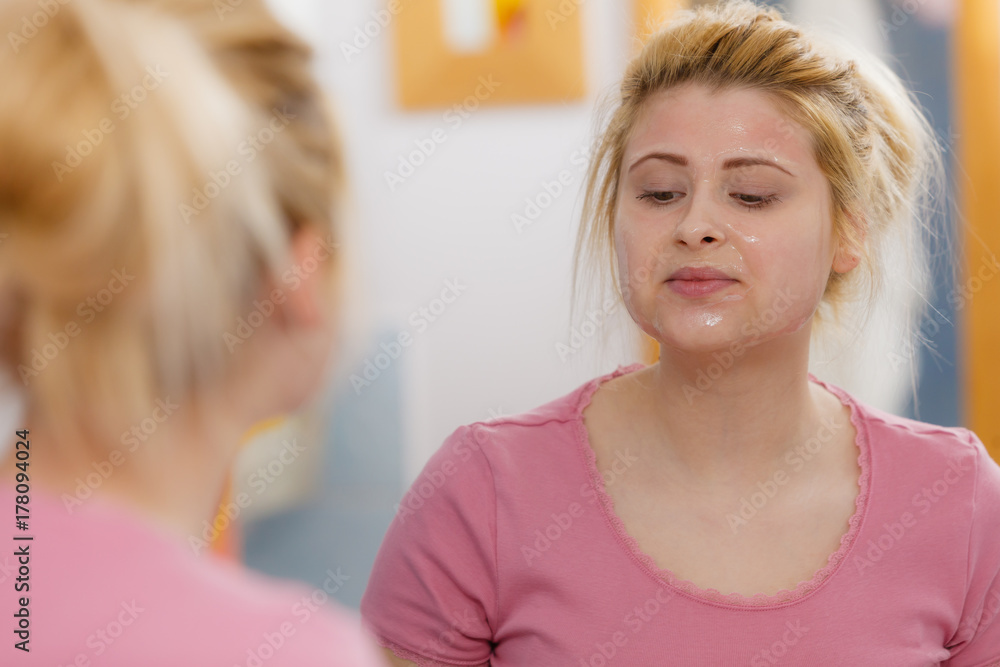 Young woman having gel mask on face Young woman having gel mask on face