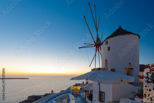 Windmill, at Oia, Santorini, Greece at sunset
