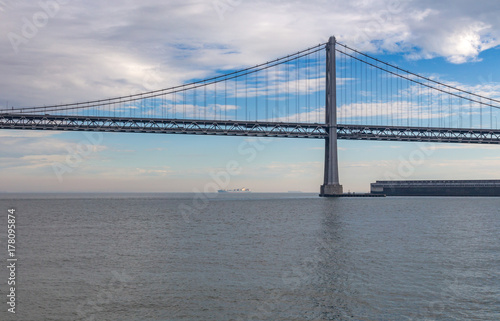 Obraz na płótnie Bay Bridge, San Fransisco, America with cloudy sky and calm watr