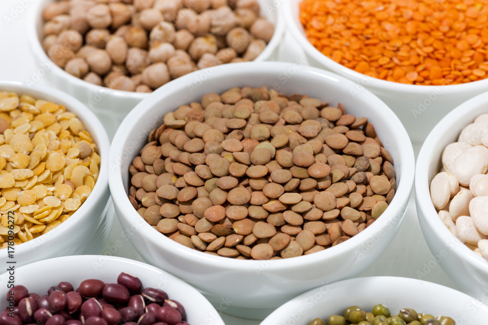 assortment of legumes in bowls, closeup assortment of legumes in bowls, closeup