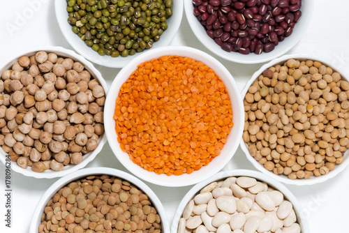 assortment of legumes in bowls, top view