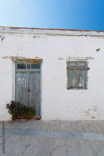 old Door and window with white wall, vertical