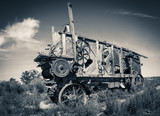 Antique threshing machine sits in a field on a farm in South Africa