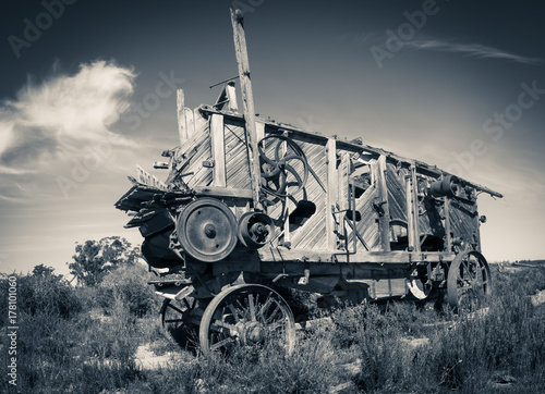 Quadro em tela Antique threshing machine sits in a field on a farm in South Africa