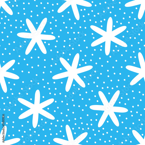 White snowflakes on blue background. Seamless pattern. Drawn by hand.