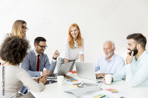 Joyful multiracial business team at work in modern office