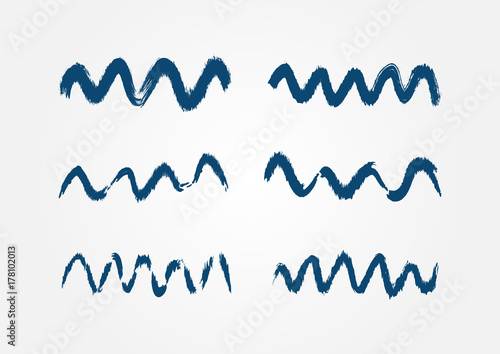 Set of isolated blue waves painted with brush strokes. Grunge, sketch, watercolor.