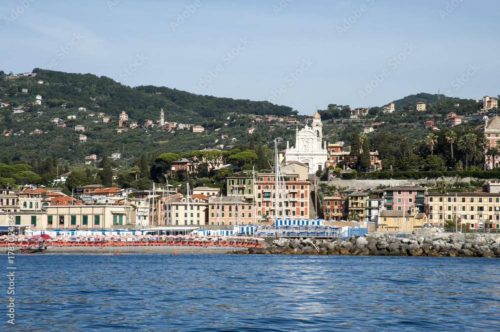 Santa Margherita Ligure, Liguria Italia -  watching the coast from the sea. the Village with the typical architecture of the houses just behind the beaches