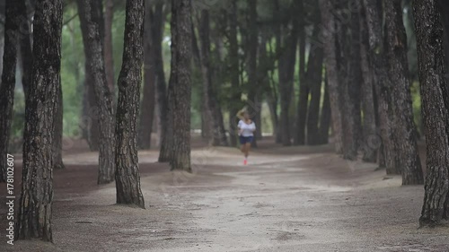 Wallpaper Mural Athlete girl running in forest in the morning Torontodigital.ca