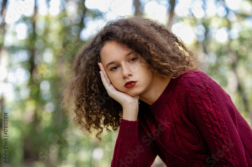 Portrait of curly hair teen...
