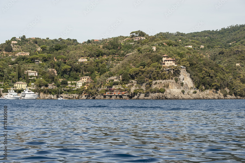 Portofino, Liguria Italia - watching the coast from the sea. View of the villas of Portofino, one of the most popular village on the Italian Riviera.