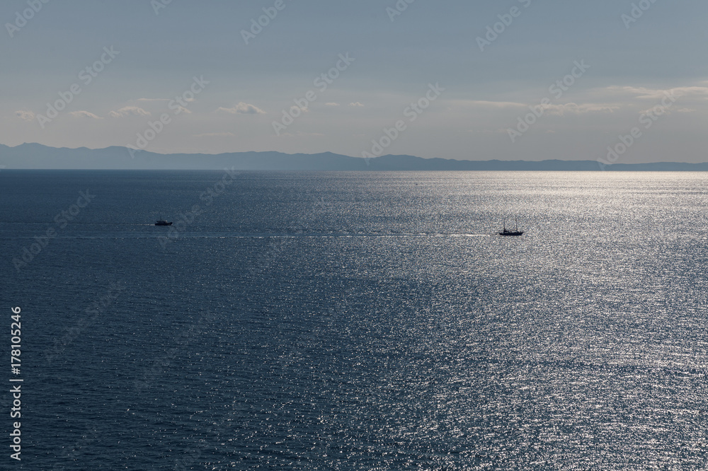 Fototapeta premium blue sea with two boats