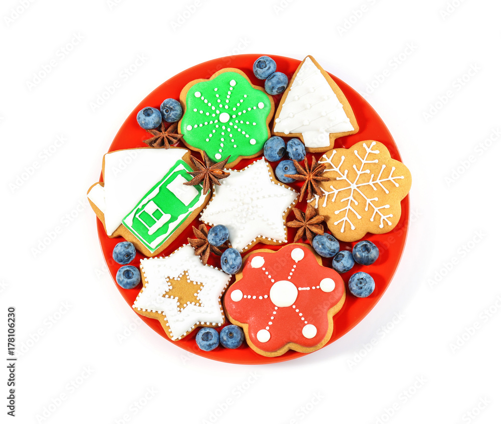 Plate with delicious Christmas cookies on white background Plate with delicious Christmas cookies on white background