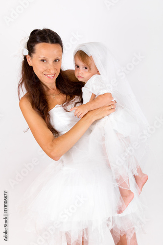 Mom and baby girl in white photography in the Studio
