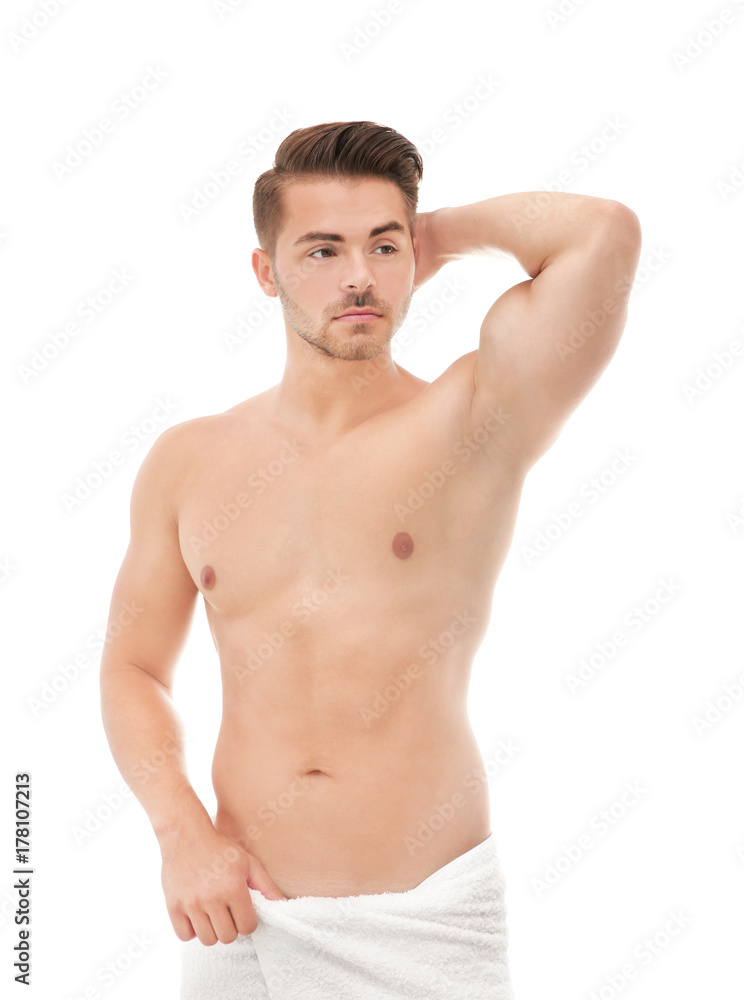 Fototapeta premium Sexy man wrapped in towel on white background
