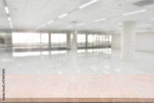 top empty wood table on blurred abstract hallway background. can be used for display or montage your product.