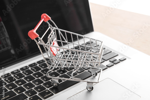 Shopping cart on computer keyboard.