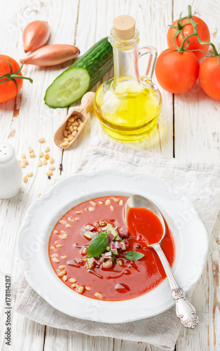 Gazpacho. Gourmet tomato soup with fresh vegetables - cucumber, onion, Basil and pine nuts. Vegetarian cuisine. Selective focus