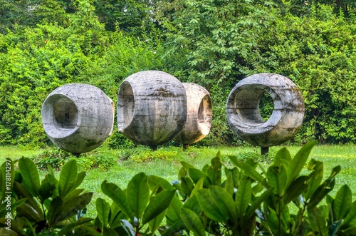 Round concrete building in the park. Spherical sculpture in the castle park in Pszczyna, Poland.
