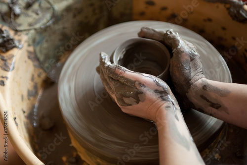 Sculpting on electric pottery wheel
