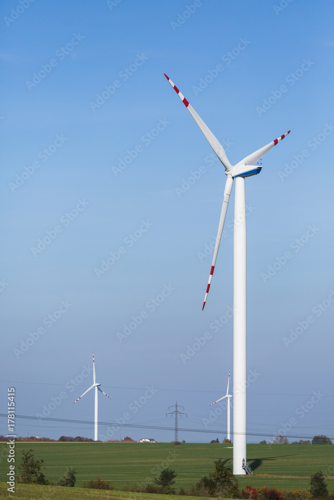 Wind generator on a background of sunset sky. Clean energy concept Wind generator on a background of sunset sky. Clean energy concept