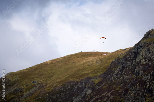 Paragliders taking off from the rocky mountain summits of the Derwent Fells in the English Lake District.