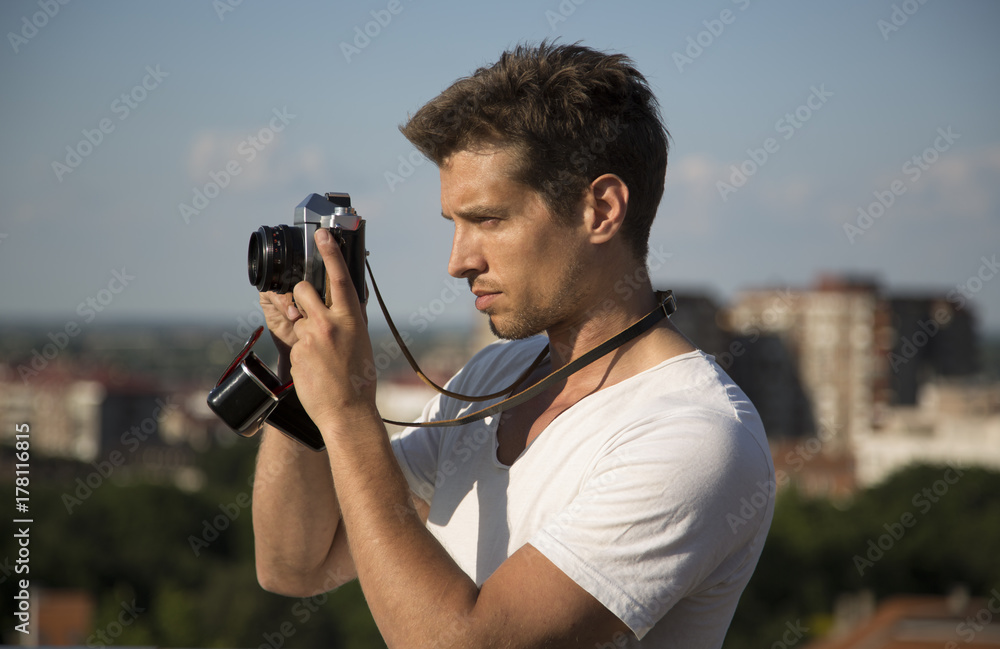 handsome man with retro camera outdoor handsome man with retro camera outdoor