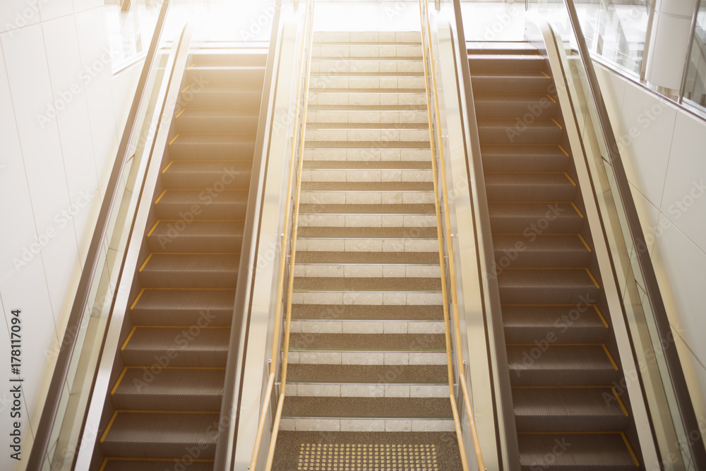 The modern urban escalators and stairs in retro light. The modern urban escalators and stairs in retro light.