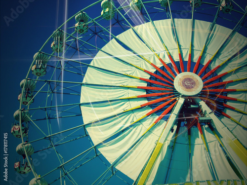 Old Vintage Ferris wheel over blue sky