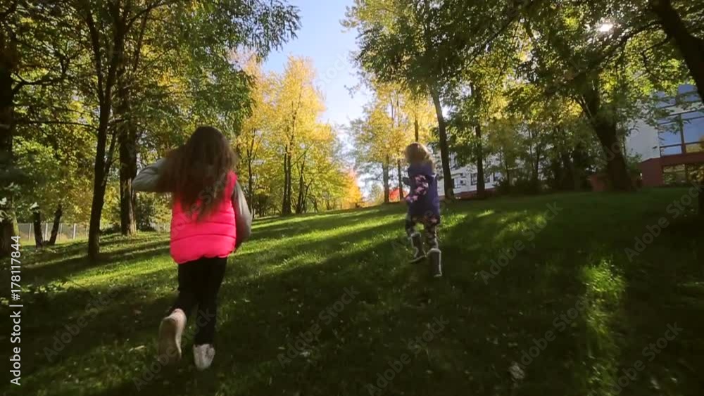 Kids playing in autumn park. Kids playing in autumn park.