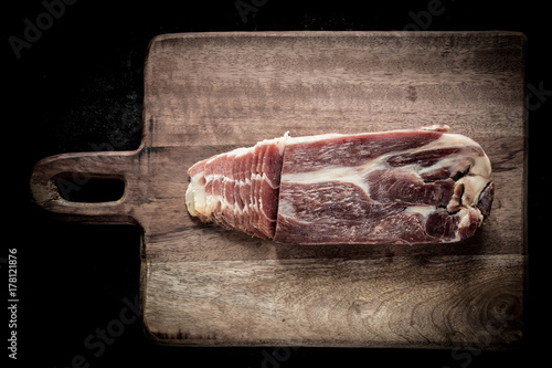Sliced jamon on a wooden board