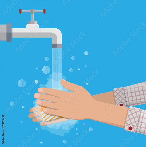 Man washes hands with soap