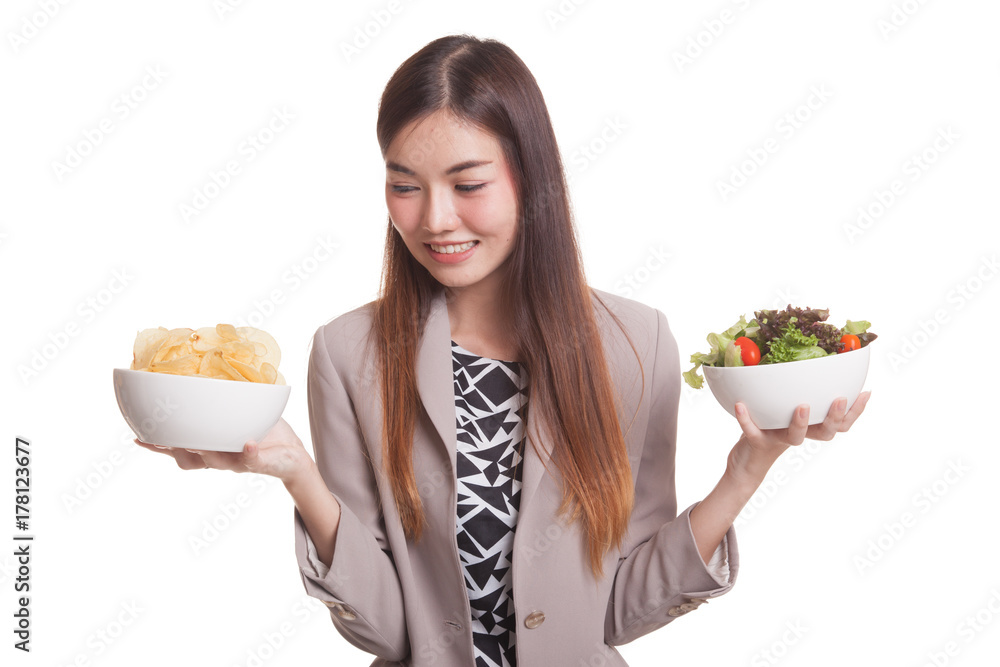 Young Asian woman with potato chips and salad. Young Asian woman with potato chips and salad.