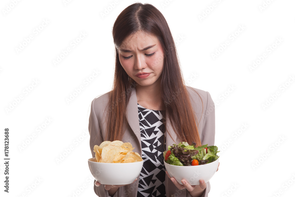 Young Asian woman with potato chips and salad. Young Asian woman with potato chips and salad.