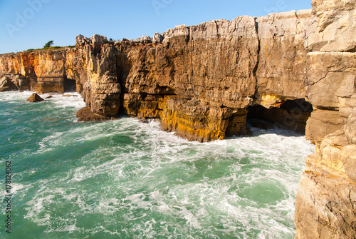 view over the cliffs washed by atlantic ocean waves at boca del inferno cascais portugal