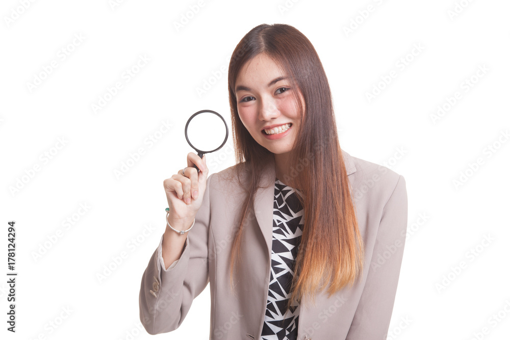 Young Asian woman with a magnifying glass. Young Asian woman with a magnifying glass.