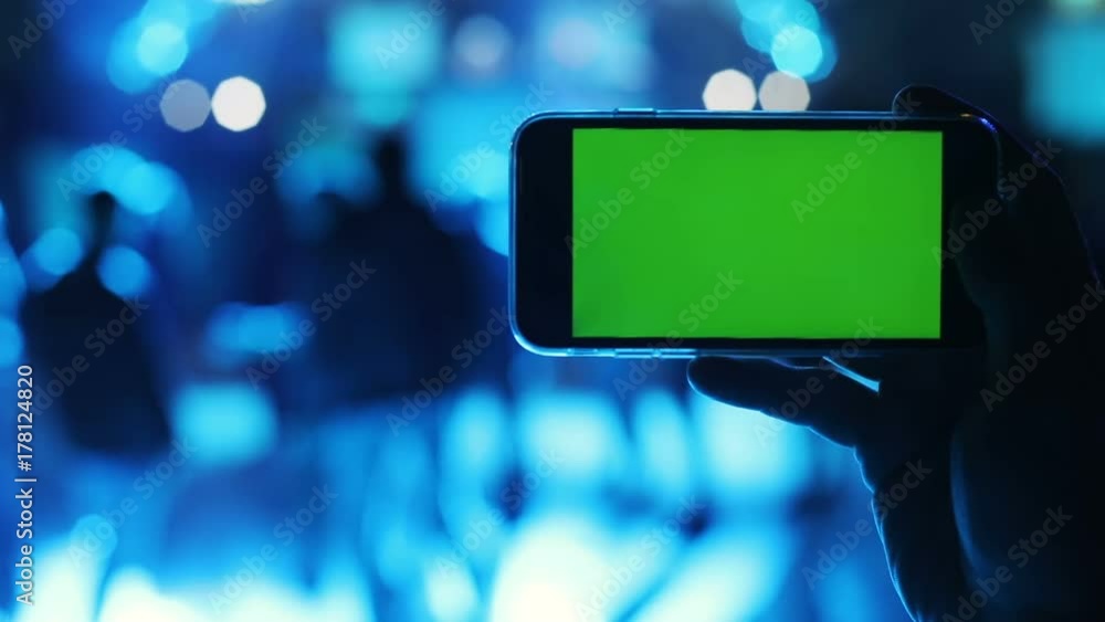 male closeup hand keeping horizontal empty green screen smart phone chromakey android system recovery browser connecting dancing people background app notification mockup 3g online internet live ether