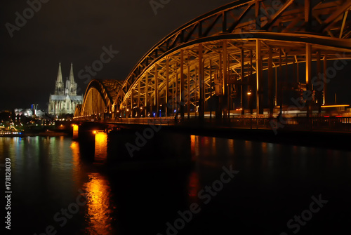 View on Hohenzollern Bridge, philharmonic hall, and Cologne Cathedral at night