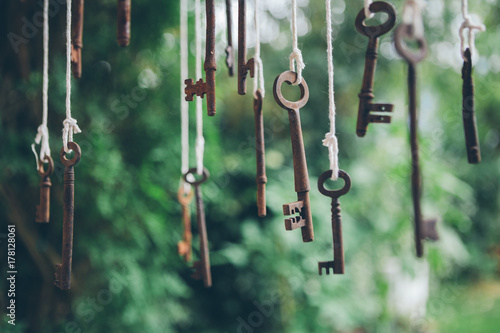 Antique keys hanging outdoors.