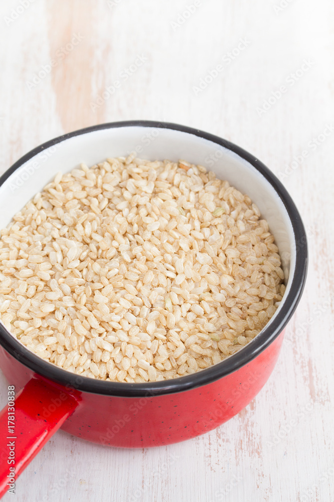uncooked integral rice on dish uncooked integral rice on dish
