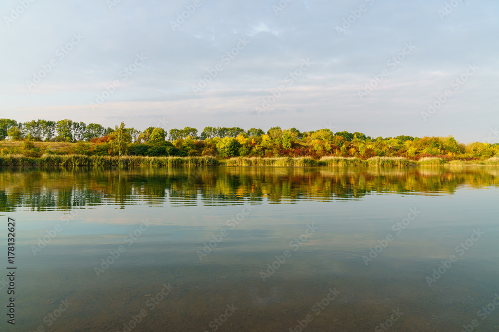 Autumn trees at the lake with reflection