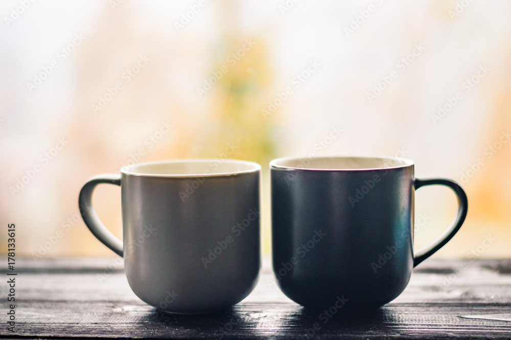 Still life with cup of coffee on the carpathian mountains background during the sunset Still life with cup of coffee on the carpathian mountains background during the sunset