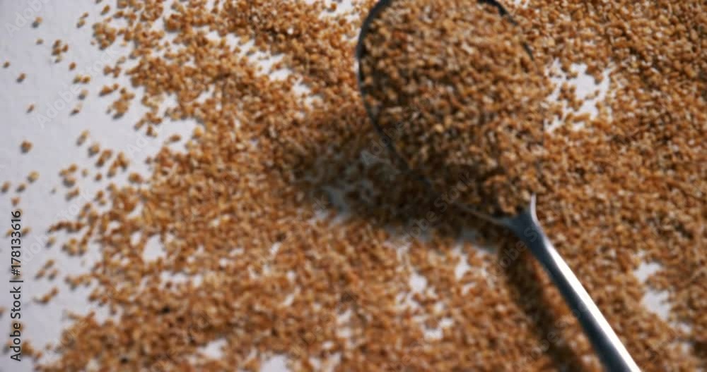 Oatmeals spilled on spoon Oatmeals spilled on spoon