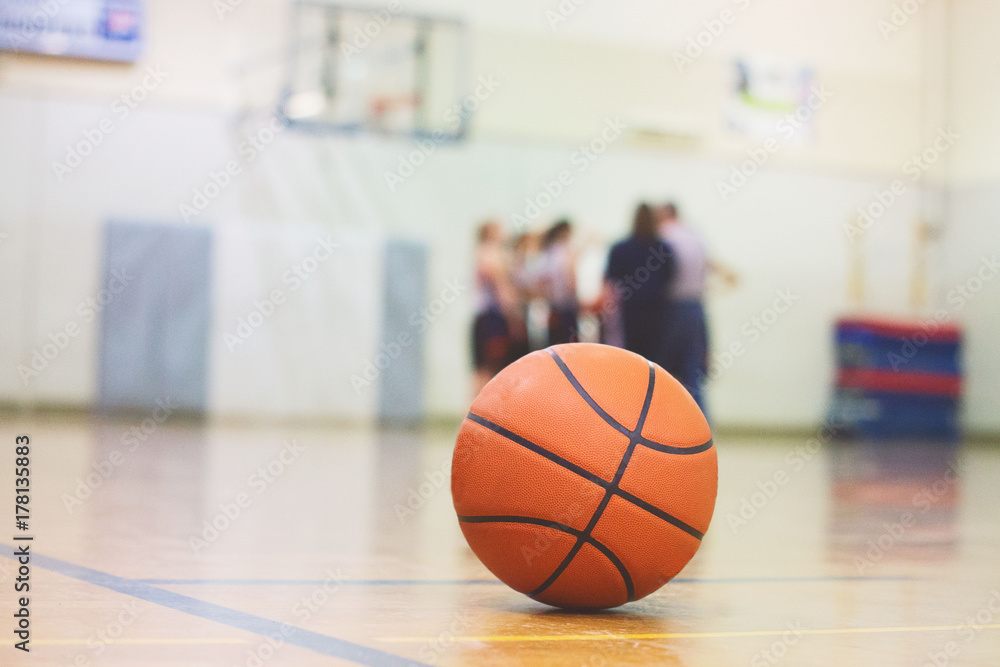 A basketball sits on a court before a game A basketball sits on a court before a game