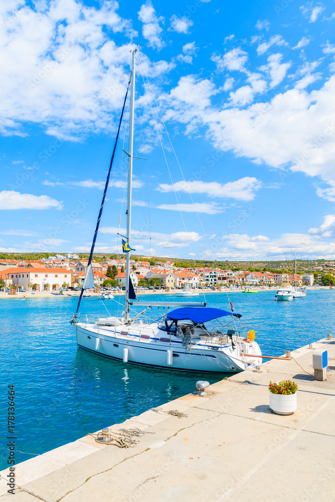 Sailing boat anchoring in Primosten port, Dalmatia, Croatia