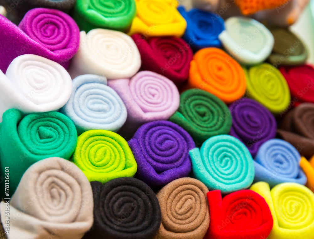 Colorful towels rolled into a tube closeup Colorful towels rolled into a tube closeup