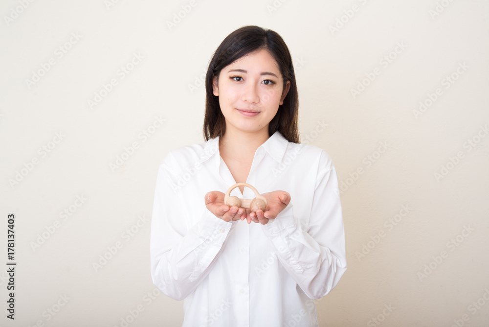 model car in young asian woman's hands model car in young asian woman's hands
