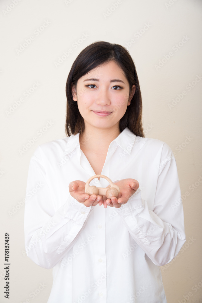 model car in young asian woman's hands model car in young asian woman's hands