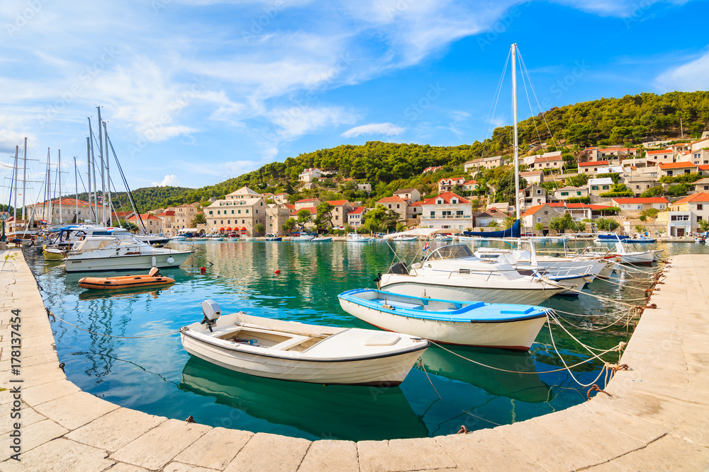 Fishing and sailing boats in beautiful port of Pucisca, Brac island, Croatia