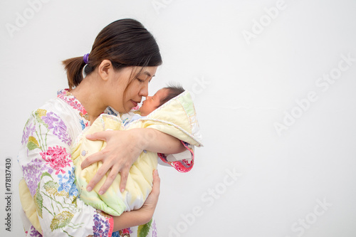 Mother Carrying Her Baby